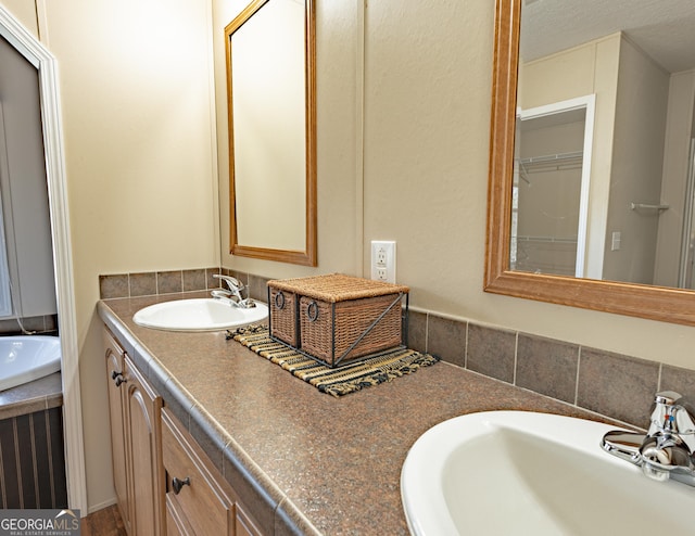 bathroom with double vanity and a sink