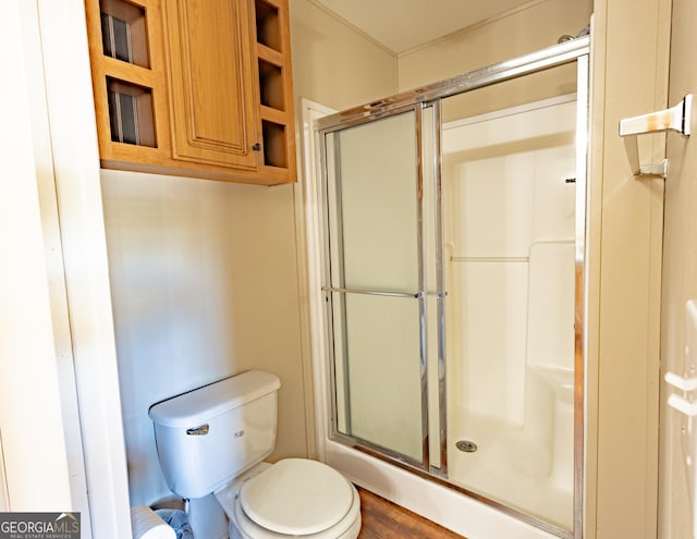 full bath with toilet and an enclosed shower