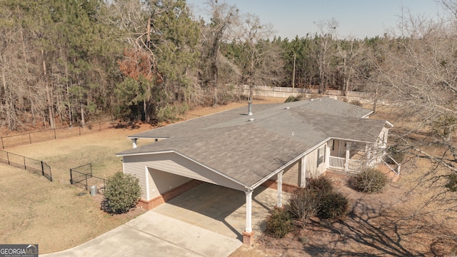 drone / aerial view featuring a view of trees