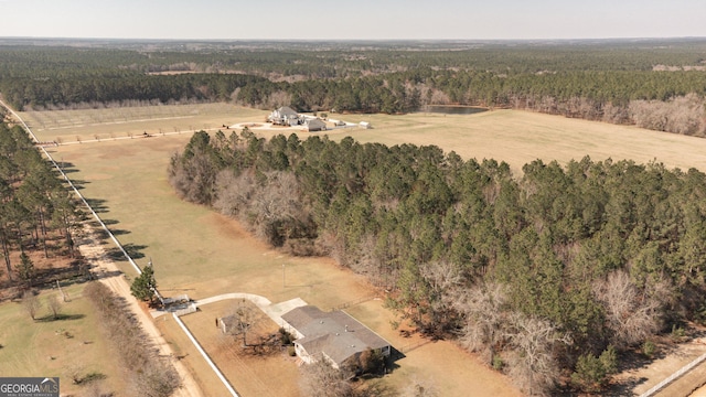 aerial view featuring a rural view and a view of trees