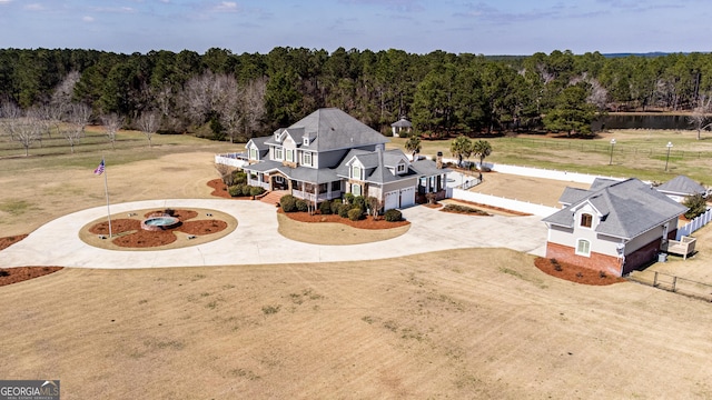 aerial view featuring a wooded view