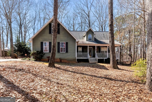 view of front facade with a porch and roof with shingles