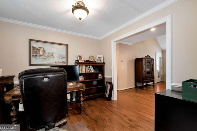 office space with crown molding, baseboards, and wood finished floors