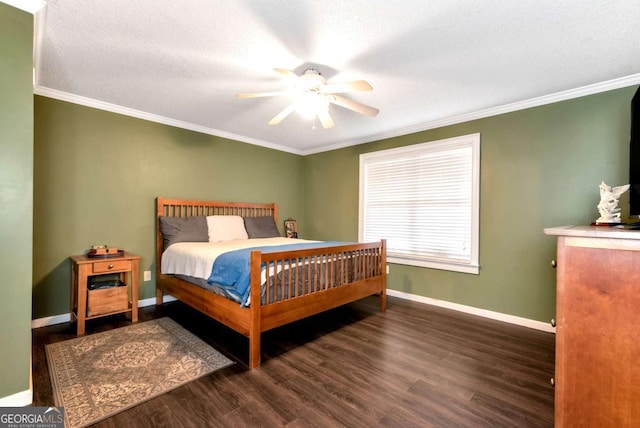 bedroom with crown molding, ceiling fan, wood finished floors, and baseboards