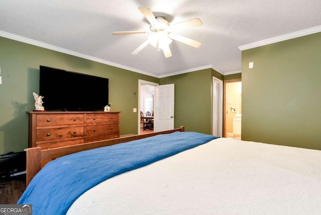 bedroom with a textured ceiling, ceiling fan, connected bathroom, wood finished floors, and ornamental molding