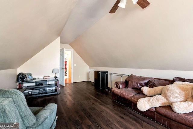 living area with lofted ceiling, ceiling fan, and wood finished floors