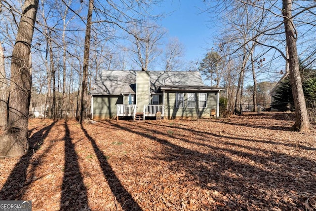 back of property featuring a deck