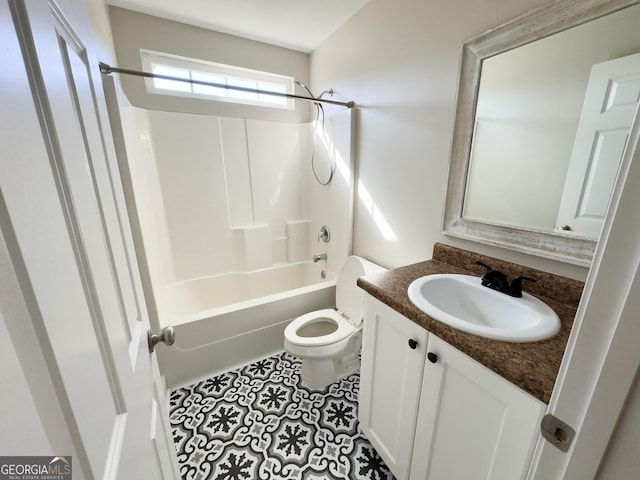 bathroom with bathing tub / shower combination, vanity, toilet, and tile patterned floors