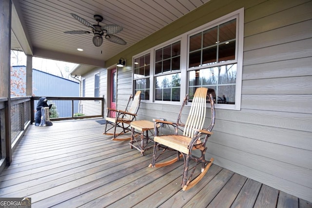 deck featuring a porch and a ceiling fan