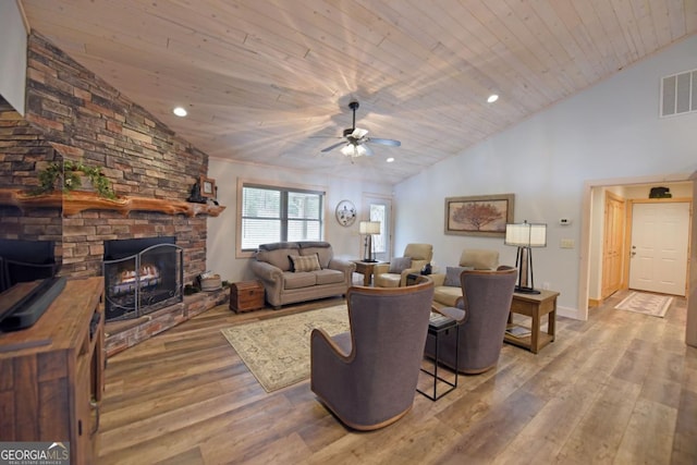 living area with visible vents, wooden ceiling, wood finished floors, a fireplace, and recessed lighting