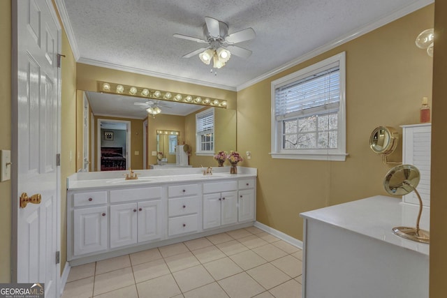 full bathroom with double vanity, ensuite bathroom, ornamental molding, a sink, and a textured ceiling