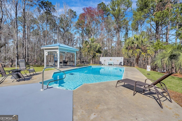 view of pool with a gazebo, a patio, fence, and a fenced in pool