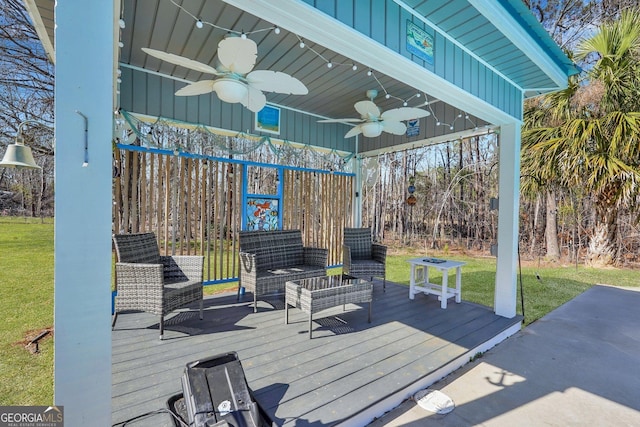 view of patio / terrace featuring a deck, outdoor lounge area, and a ceiling fan