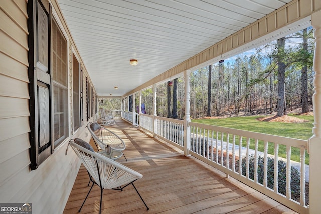 wooden terrace featuring a porch