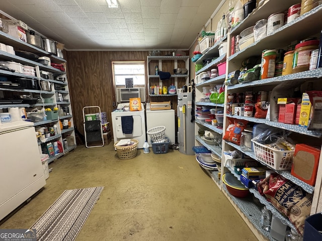 storage area featuring washer and dryer, water heater, and cooling unit