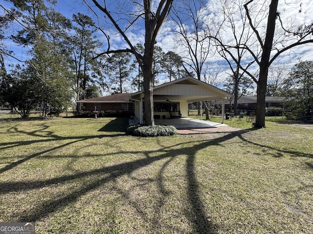 exterior space featuring driveway and an attached carport