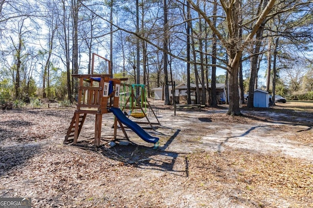 community jungle gym featuring an outbuilding and a shed