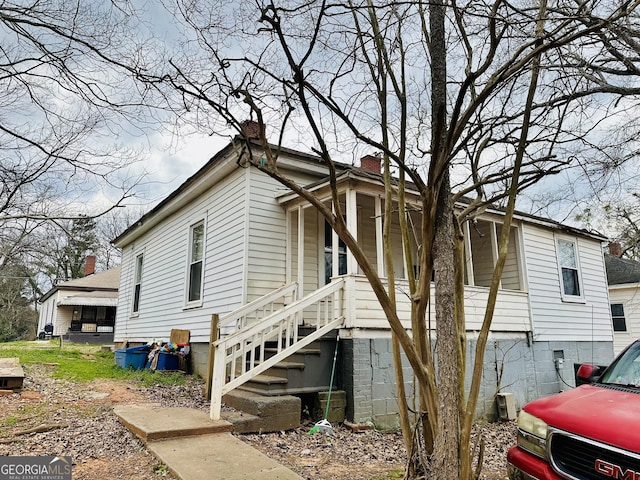 view of home's exterior with a chimney