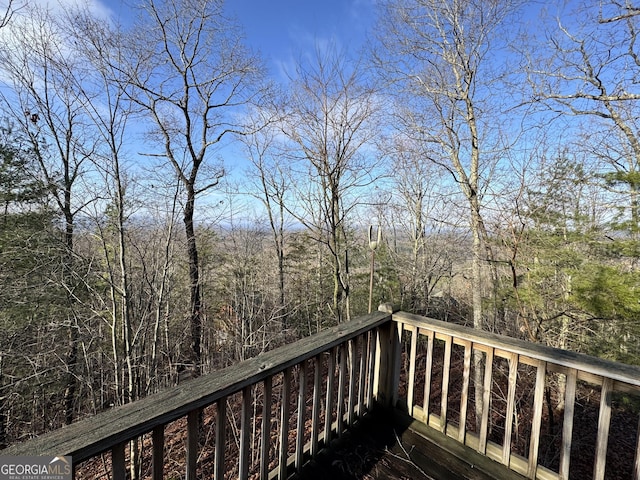 deck featuring a forest view