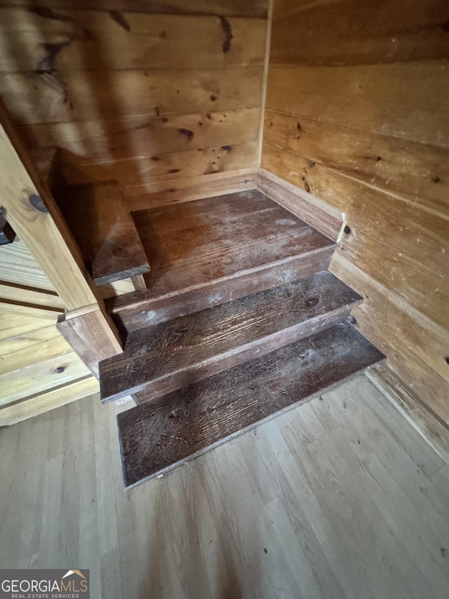 stairs with wood finished floors