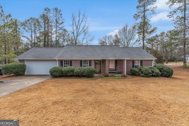 ranch-style house featuring brick siding, a shingled roof, an attached garage, driveway, and a front lawn