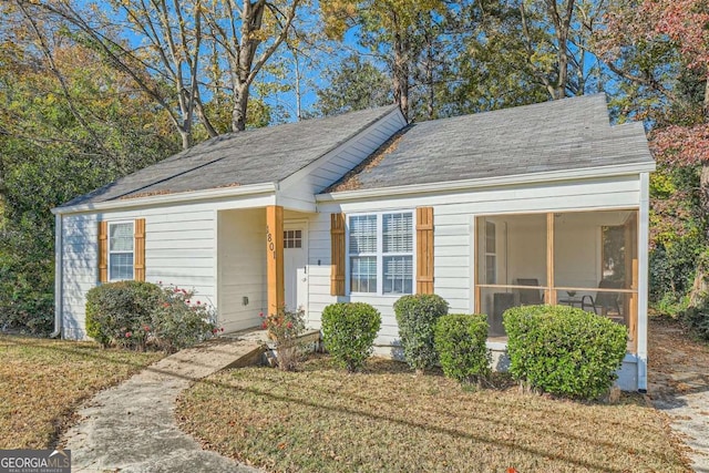 view of front of house with a sunroom