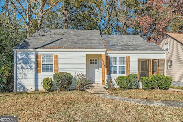 ranch-style home with a front yard