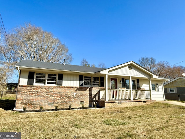 ranch-style home with crawl space, a front yard, a porch, and brick siding