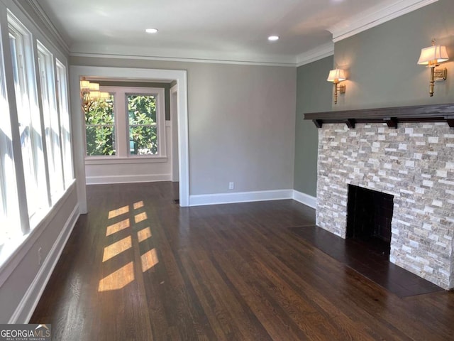 unfurnished living room with a fireplace with flush hearth, ornamental molding, baseboards, and wood finished floors