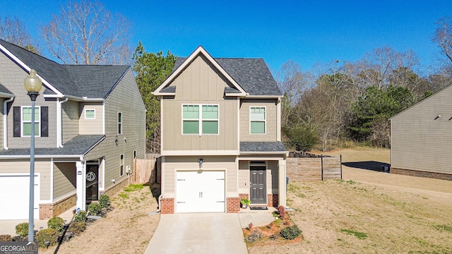 craftsman-style house with brick siding, concrete driveway, board and batten siding, fence, and a garage