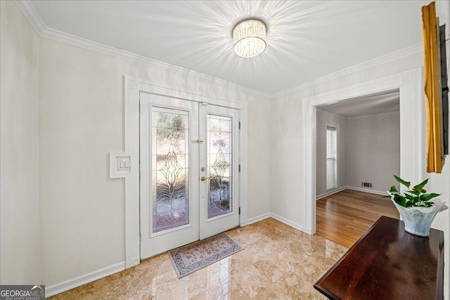 doorway to outside with visible vents, baseboards, ornamental molding, and french doors