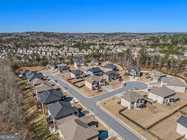 birds eye view of property with a residential view