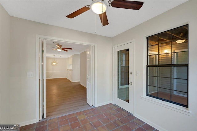 interior space featuring ceiling fan