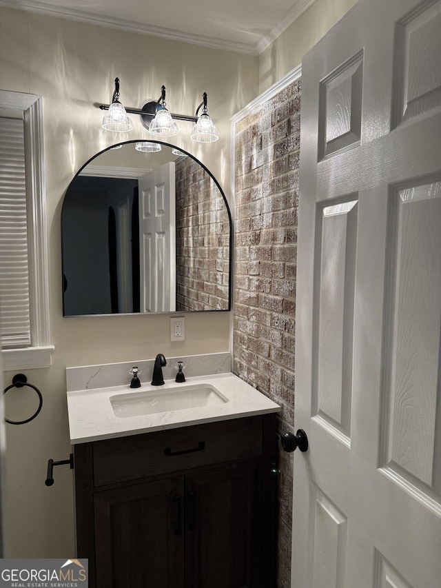 bathroom featuring ornamental molding and vanity