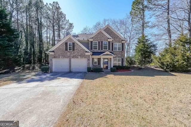 view of front of home with brick siding, driveway, and a front lawn