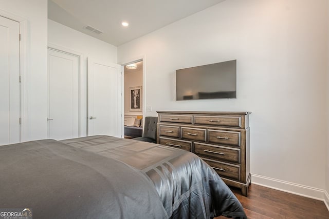 bedroom with recessed lighting, visible vents, baseboards, and dark wood-style flooring