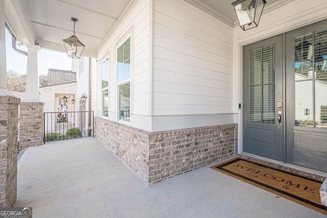 doorway to property with brick siding