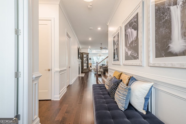 hall featuring dark wood-style floors, recessed lighting, stairs, and ornamental molding