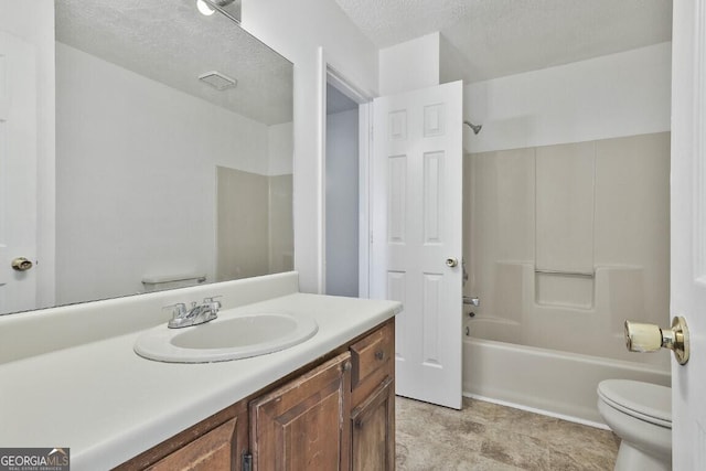 bathroom featuring a textured ceiling, toilet, visible vents, vanity, and washtub / shower combination