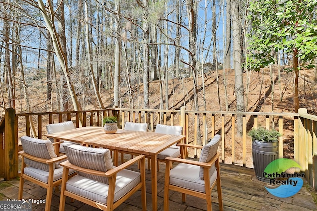 wooden deck featuring outdoor dining space