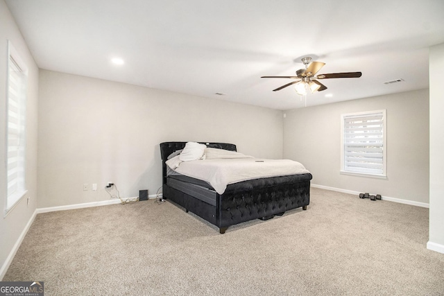 bedroom with carpet, visible vents, and baseboards