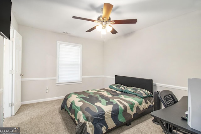 bedroom featuring ceiling fan, carpet, visible vents, and baseboards