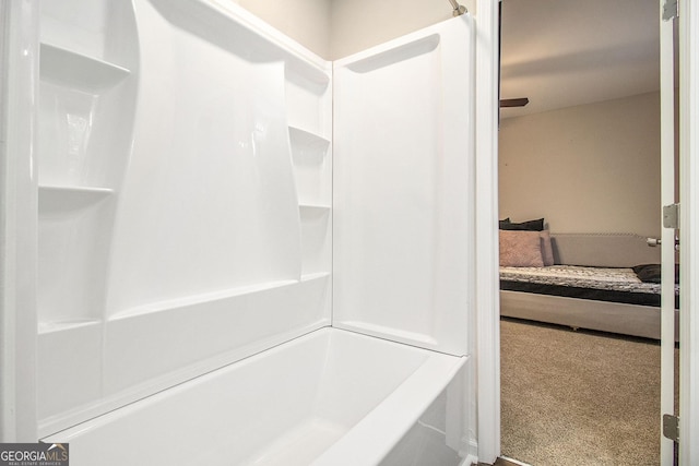 full bathroom with a washtub and a shower