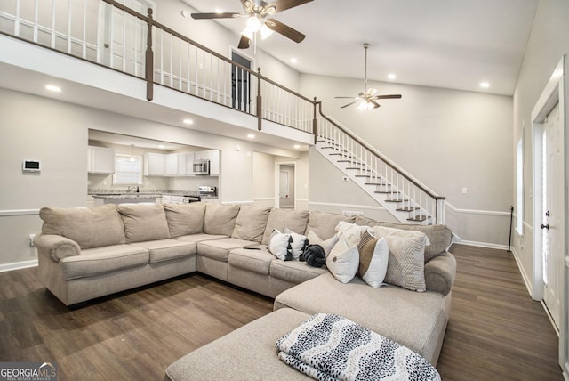 living area featuring dark wood-style flooring, stairway, recessed lighting, and baseboards