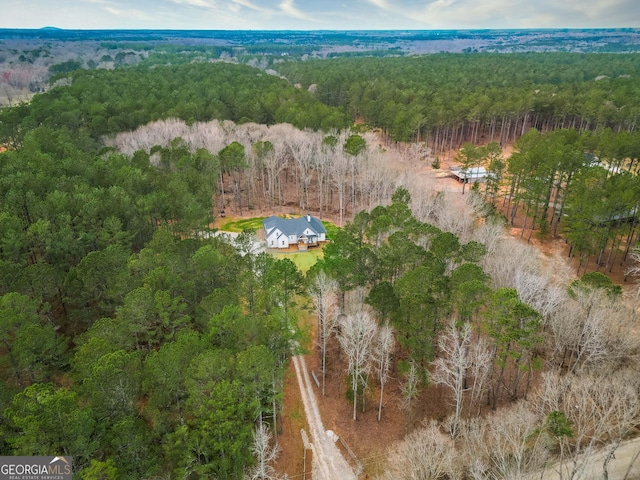 drone / aerial view featuring a view of trees