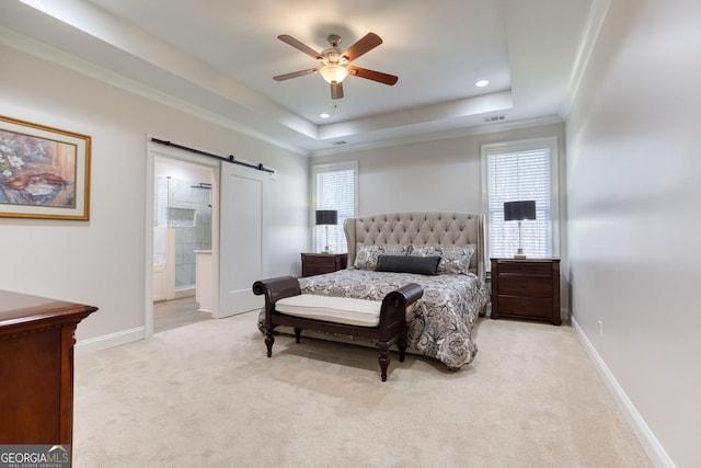 carpeted bedroom featuring a barn door, visible vents, baseboards, a raised ceiling, and recessed lighting