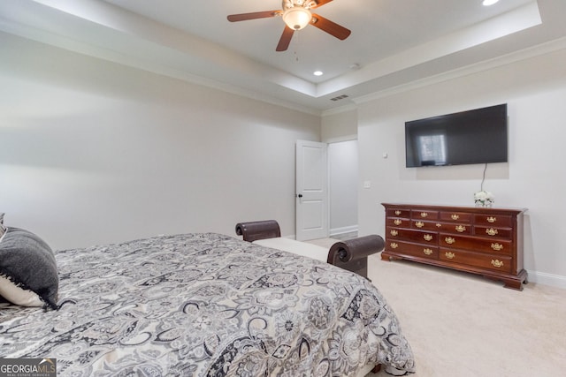 bedroom featuring carpet floors, a tray ceiling, crown molding, and recessed lighting