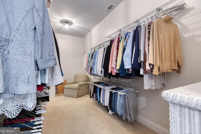 spacious closet with visible vents and carpet flooring