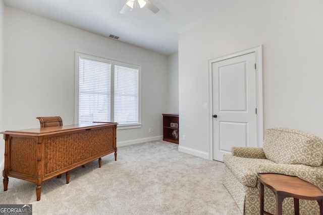 office with carpet floors, a ceiling fan, visible vents, and baseboards