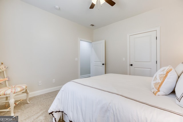 bedroom with carpet floors, visible vents, baseboards, and ceiling fan